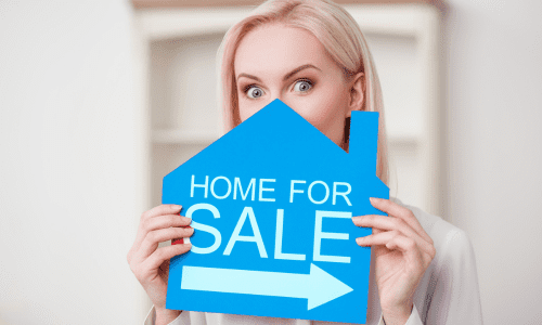 selling without an agent woman holding sign